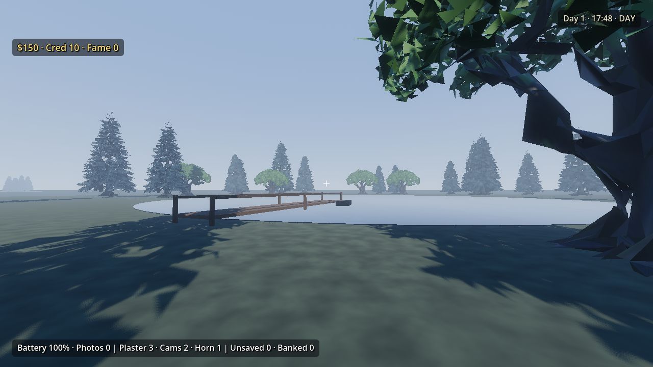 A broad oak and a wooden dock at a lake