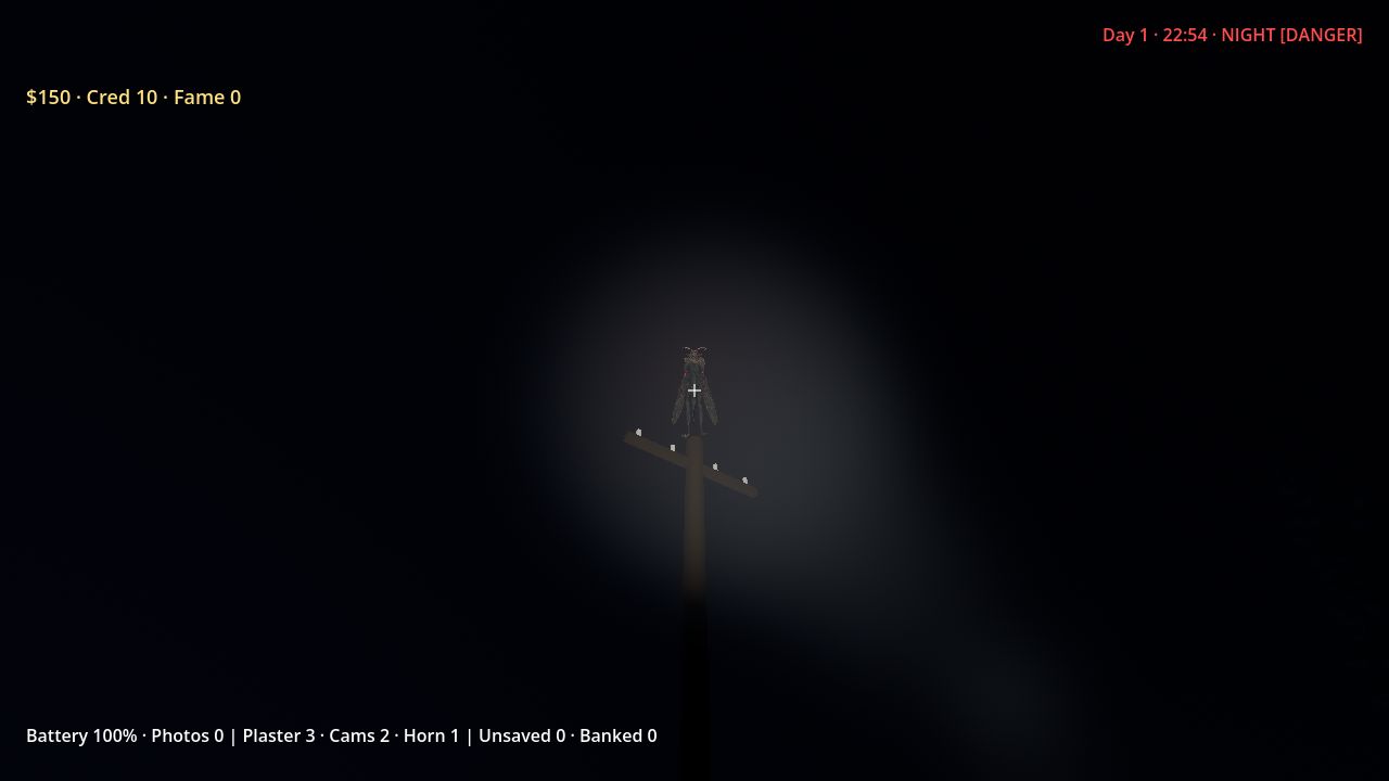 A dark winged figure on a pole lit by a flashlight